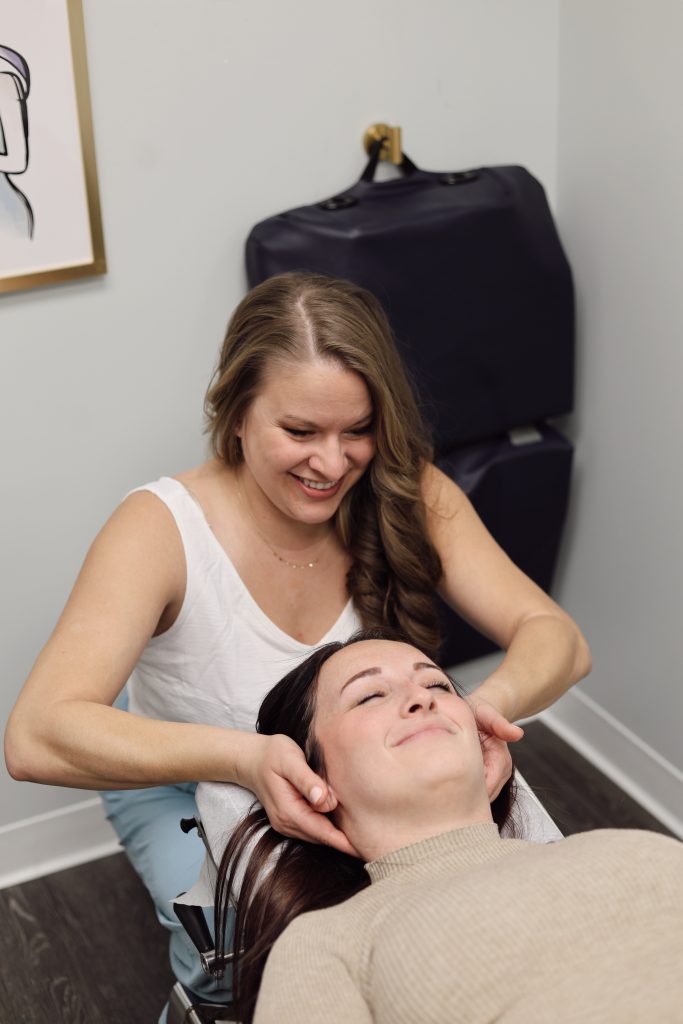 Patient receiving a gentle neck adjustment at Fishel Chiropractic
